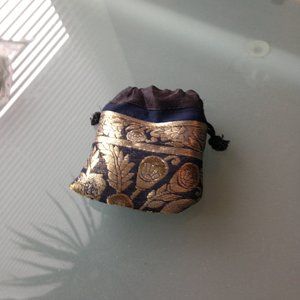 Indian gold and back silk jewelry bag